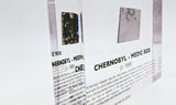 Clear acrylic display case featuring a historical fragment of a Chernobyl medic box, offering an educational presentation for collectors and those interested in nuclear history.