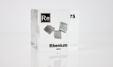 Rhenium element in a clear acrylic cube, featuring its name, atomic number, and properties as shown on the periodic table. A sleek and educational display for collectors and enthusiasts.
