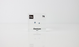 Piece of Osmium encased in a clear acrylic cube, with the element's name, atomic number, and properties displayed as on the periodic table for a sleek, educational display.