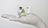 Clear acrylic cube displaying an Actinium element (Atomic Number 89) embedded within, offering a scientific presentation for collectors and science enthusiasts.