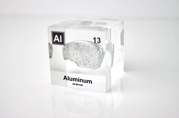 Clear acrylic cube displaying an Aluminum ampule with its atomic number 13. Perfect for educational settings, scientific collections, or as a unique decorative piece.