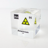 Clear acrylic cube displaying an Americium element (Atomic Number 95) embedded within, offering a scientific presentation for collectors and science enthusiasts. Radiation symbol.