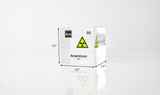 Clear acrylic cube displaying an Americium element (Atomic Number 95) embedded within, offering a scientific presentation for collectors and science enthusiasts. Radiation symbol.