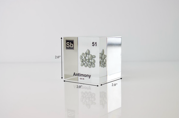 Clear acrylic cube displaying an Antimony element (Atomic Number 51) embedded within, offering a scientific presentation for collectors and science enthusiasts.