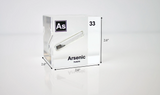Arsenic element encased in a clear acrylic cube, showcasing its name, atomic number 33, and key properties from the periodic table. Shows dimensions of acrylic product. An informative and visually striking piece ideal for educational purposes and collectors.