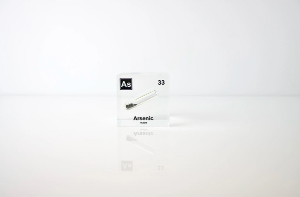 Arsenic element encased in a clear acrylic cube, showcasing its name, atomic number 33, and key properties from the periodic table. An informative and visually striking piece ideal for educational purposes and collectors.