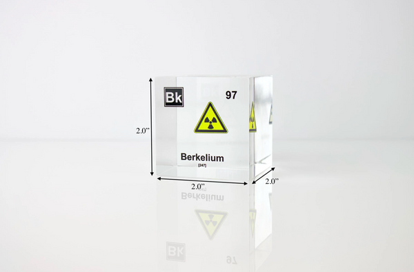 Clear acrylic cube displaying a Berkelium element (Atomic Number 97) embedded within, offering a scientific presentation for collectors and science enthusiasts. Radiation symbol.