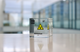 Clear acrylic cube displaying a Berkelium element (Atomic Number 97) embedded within, offering a scientific presentation for collectors and science enthusiasts. Radiation symbol.