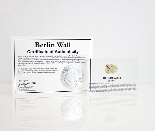 Clear acrylic display case featuring a historical fragment of the Berlin Wall, providing an authentic and educational presentation for history enthusiasts and collectors.