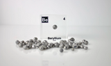 Clear acrylic cube encasing a Beryllium ampule with its atomic number 4. Ideal for display in educational settings, scientific collections, or as a decorative piece.