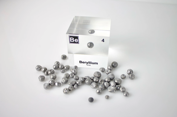 Clear acrylic cube encasing a Beryllium ampule with its atomic number 4. Ideal for display in educational settings, scientific collections, or as a decorative piece.