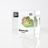 Clear acrylic cube displaying a Bismuth element (Atomic Number 83) embedded within, offering a scientific presentation for collectors and science enthusiasts.