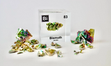 Clear acrylic cube displaying a Bismuth element (Atomic Number 83) embedded within, offering a scientific presentation for collectors and science enthusiasts.