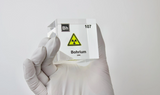 Clear acrylic cube displaying a Bohrium element (Atomic Number 107) embedded within, offering a scientific presentation for collectors and science enthusiasts. Radiation symbol.