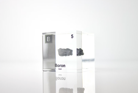 Clear acrylic cube encasing a Boron ampule with its atomic number 5. Ideal for display in educational settings, scientific collections, or as a decorative piece.