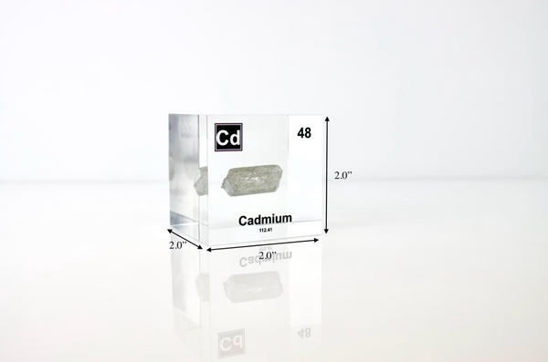 Clear acrylic cube displaying a Cadmium element (Atomic Number 48) embedded within, offering a scientific presentation for collectors and science enthusiasts.