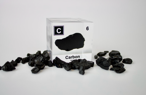 Clear acrylic cube encasing a Carbon ampule with its atomic number 6. Ideal for display in educational settings, scientific collections, or as a decorative piece.