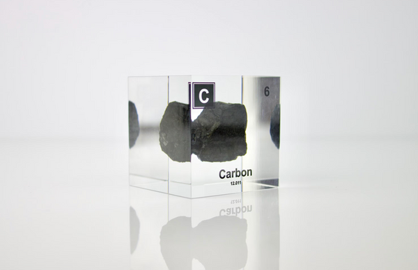 Clear acrylic cube encasing a Carbon ampule with its atomic number 6. Ideal for display in educational settings, scientific collections, or as a decorative piece.