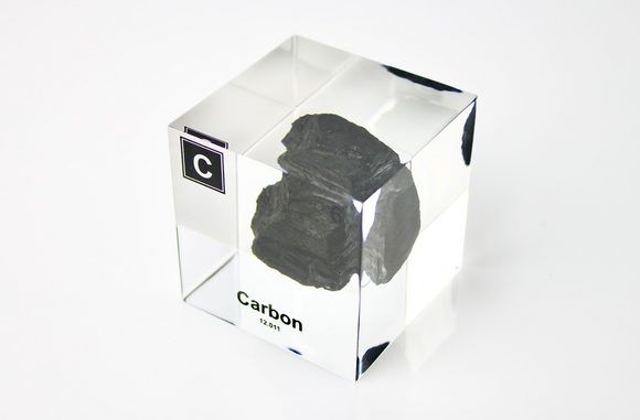 Clear acrylic cube encasing a Carbon ampule with its atomic number 6. Ideal for display in educational settings, scientific collections, or as a decorative piece.