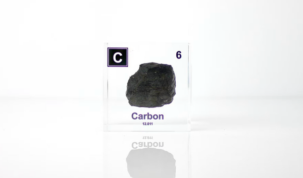 Clear acrylic cube encasing a Carbon ampule with its atomic number 6. Ideal for display in educational settings, scientific collections, or as a decorative piece.