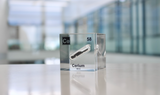 Clear acrylic cube displaying a Cerium element (Atomic Number 58) embedded within, offering a scientific presentation for collectors and science enthusiasts.