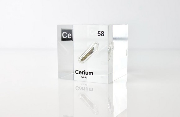 Clear acrylic cube displaying a Cerium element (Atomic Number 58) embedded within, offering a scientific presentation for collectors and science enthusiasts.