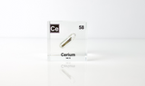 Clear acrylic cube displaying a Cerium element (Atomic Number 58) embedded within, offering a scientific presentation for collectors and science enthusiasts.