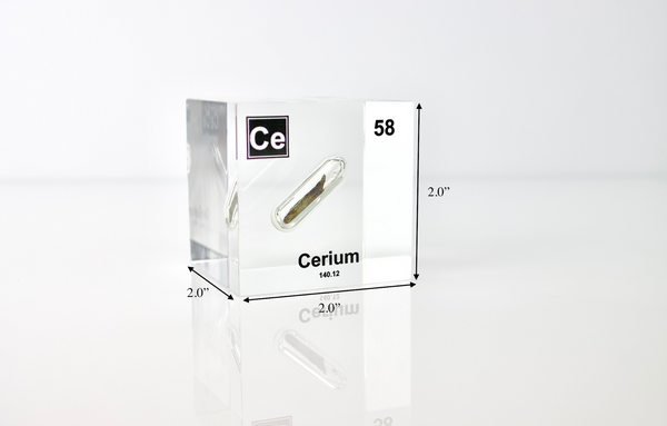 Clear acrylic cube displaying a Cerium element (Atomic Number 58) embedded within, offering a scientific presentation for collectors and science enthusiasts.