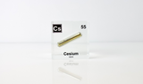 Clear acrylic cube displaying a Cesium element (Atomic Number 55) embedded within, offering a scientific presentation for collectors and science enthusiasts.