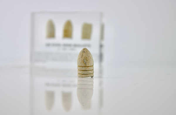 Clear acrylic display case featuring historical Civil War bullets, offering an educational presentation for collectors and enthusiasts of American history.