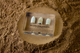 Clear acrylic display case featuring historical Civil War bullets, offering an educational presentation for collectors and enthusiasts of American history.