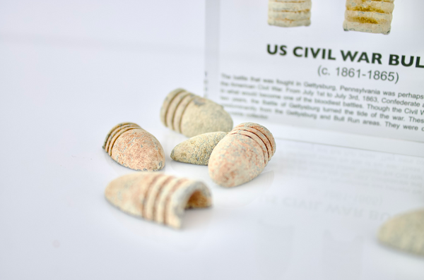 Clear acrylic display case featuring historical Civil War bullets, offering an educational presentation for collectors and enthusiasts of American history.