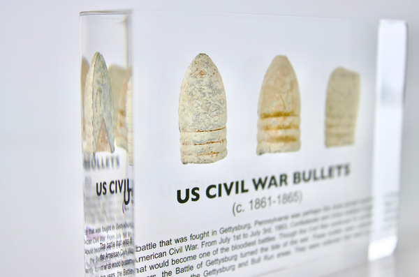 Clear acrylic display case featuring historical Civil War bullets, offering an educational presentation for collectors and enthusiasts of American history.