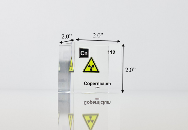 Clear acrylic cube displaying a Copernicium element (Atomic Number 112) embedded within, offering a scientific presentation for collectors and science enthusiasts.