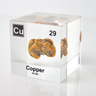 Clear acrylic cube displaying Copper element with its name, atomic number 29, and periodic table properties. Perfect for educational purposes and collectors.