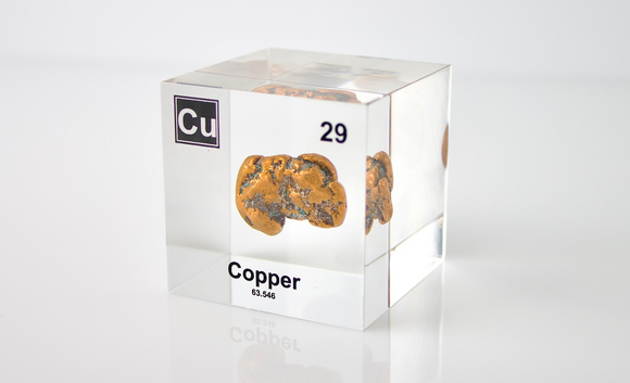 Clear acrylic cube displaying Copper element with its name, atomic number 29, and periodic table properties. Perfect for educational purposes and collectors.