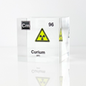 Clear acrylic cube displaying a Curium element (Atomic Number 96) embedded within, offering a scientific presentation for collectors and science enthusiasts.