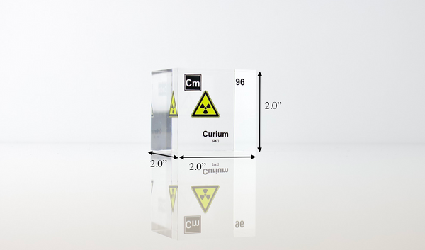 Clear acrylic cube displaying a Curium element (Atomic Number 96) embedded within, offering a scientific presentation for collectors and science enthusiasts.