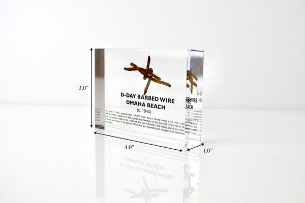 Clear acrylic display case featuring a historical fragment of D-Day barbed wire, offering an educational presentation for collectors and those interested in World War II history.