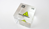 Clear acrylic cube displaying a Darmstadtium element (Atomic Number 110) embedded within, offering a scientific presentation for collectors and science enthusiasts.