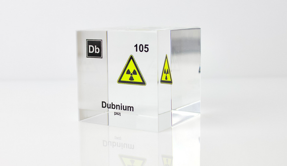 Clear acrylic cube displaying a Dubnium element (Atomic Number 105) embedded within, offering a scientific presentation for collectors and science enthusiasts.