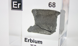 Clear acrylic cube displaying an Erbium element (Atomic Number 68) embedded within, offering a scientific presentation for collectors and science enthusiasts.