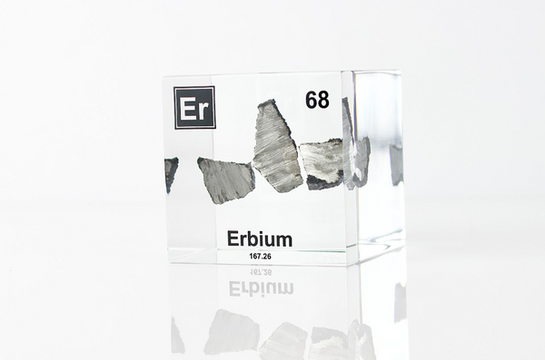 Clear acrylic cube displaying an Erbium element (Atomic Number 68) embedded within, offering a scientific presentation for collectors and science enthusiasts.