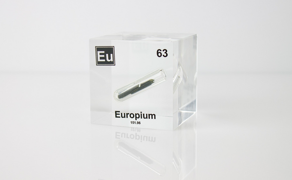 Clear acrylic cube displaying an Europium element (Atomic Number 63) embedded within, offering a scientific presentation for collectors and science enthusiasts.