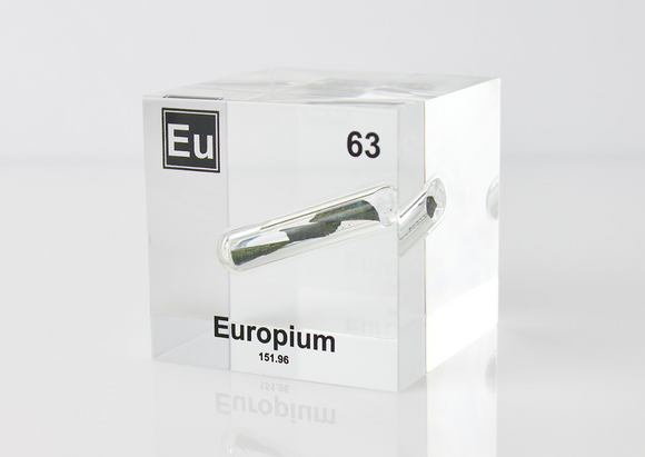 Clear acrylic cube displaying an Europium element (Atomic Number 63) embedded within, offering a scientific presentation for collectors and science enthusiasts.