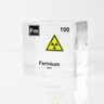 Clear acrylic cube displaying a Fermium element (Atomic Number 100) embedded within, offering a scientific presentation for collectors and science enthusiasts.