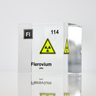 Clear acrylic cube displaying a Flerovium element (Atomic Number 114) embedded within, offering a scientific presentation for collectors and science enthusiasts.
