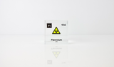 Clear acrylic cube displaying a Flerovium element (Atomic Number 114) embedded within, offering a scientific presentation for collectors and science enthusiasts.