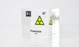 Clear acrylic cube displaying a Francium element (Atomic Number 87) embedded within, offering a scientific presentation for collectors and science enthusiasts.