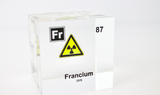 Clear acrylic cube displaying a Francium element (Atomic Number 87) embedded within, offering a scientific presentation for collectors and science enthusiasts.